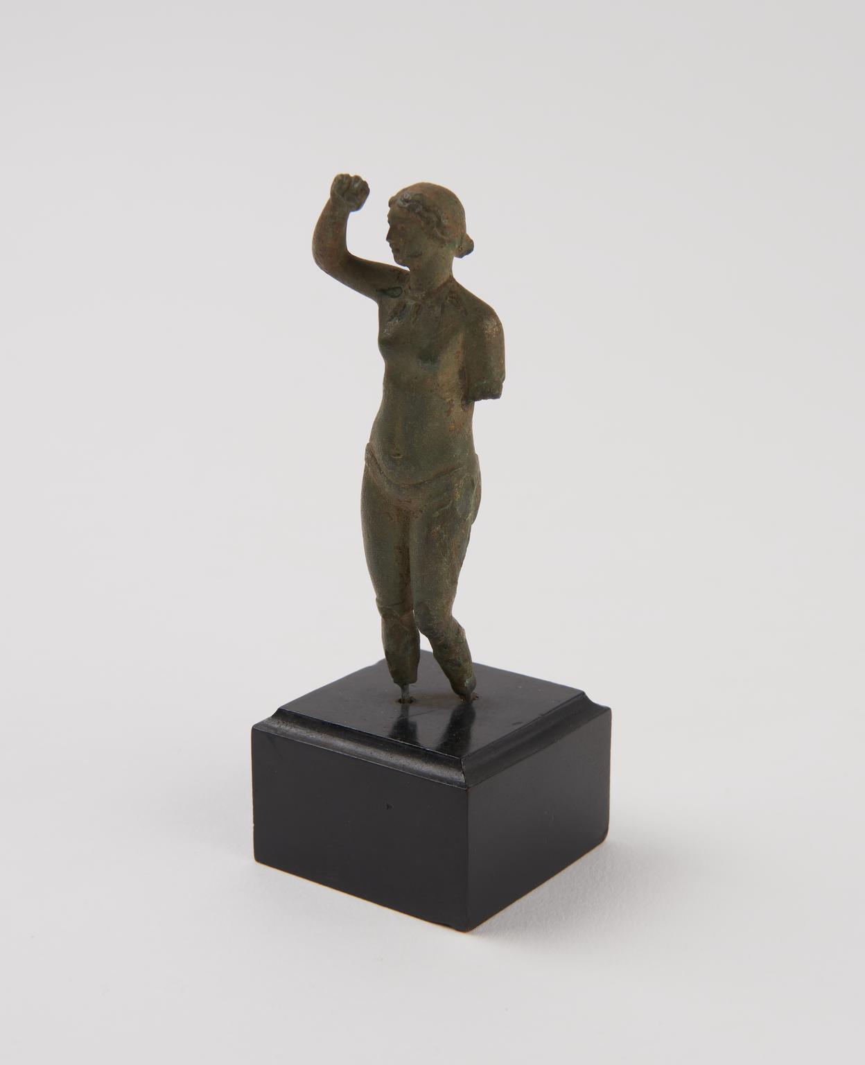 Small statue of a female exercising | Science Museum Group Collection