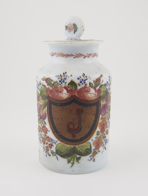 White glass shop round with floral decoration, for unknown drug