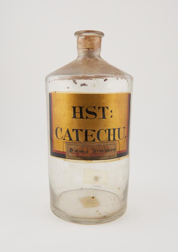 Bottle, clear glass, trace contents, for catecha draught