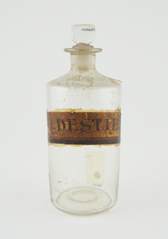 Bottle, clear glass, empty, for distilled water, English