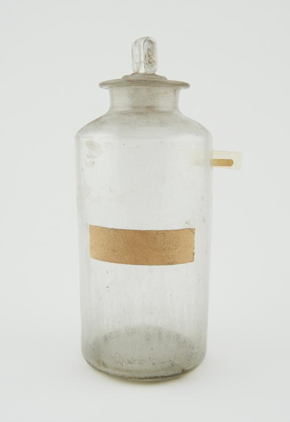 Bottle, clear glass, with contents, English, late 19th century