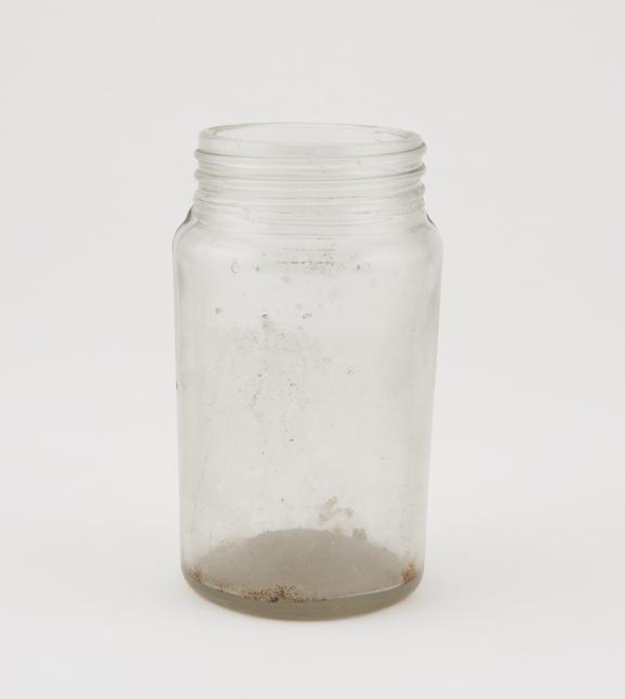 Clear glass storage jar, originally with screw-on cap