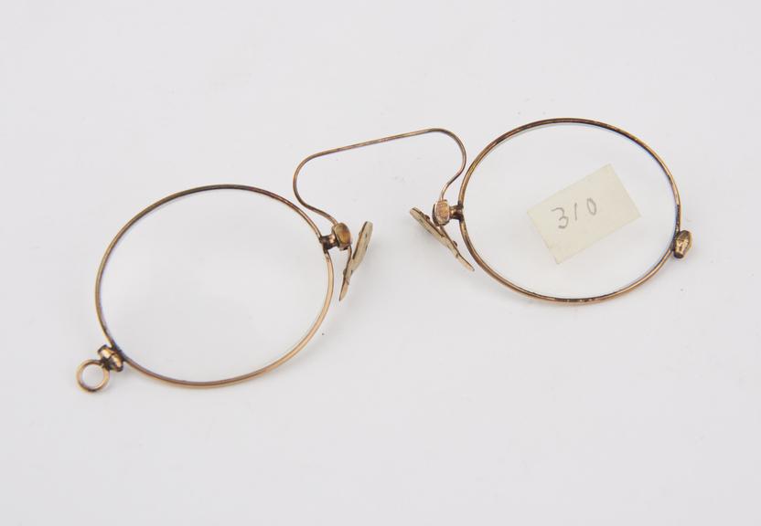 Gold plated clip eyeglasses with oval lenses and ivory plaquets