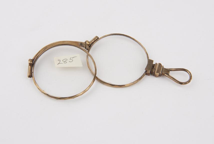 Gold folding eyeglasses with round lenses and elastic solid