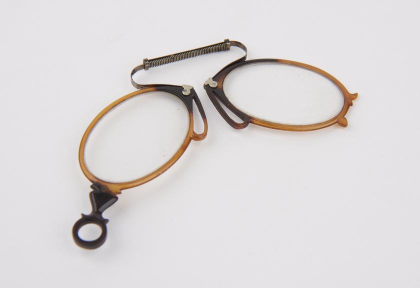 Tortoiseshell folding (?) eyeglasses with oval lenses and