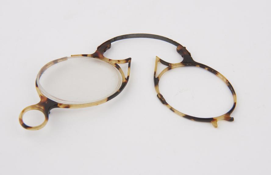 Lady's style tortoiseshell folding eyeglasses with oval lenses