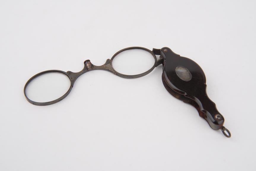 Silver foldover eyeglasses with oval lenses