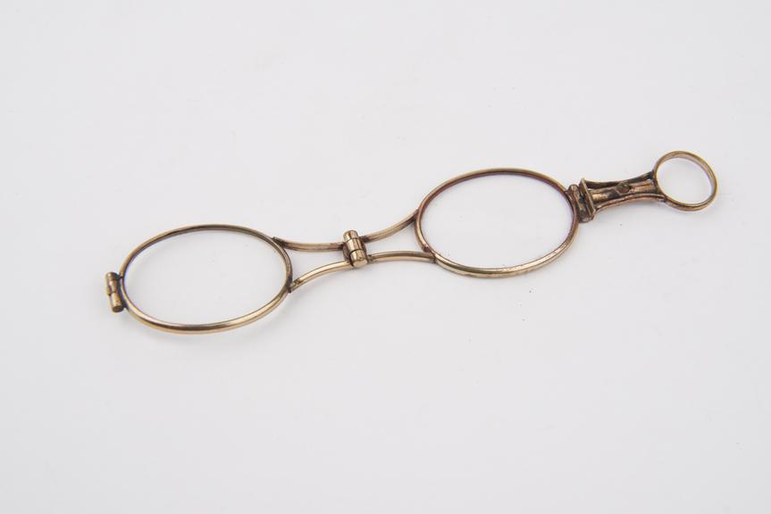 Gold-plated foldover eyeglasses with oval lenses, ca 1830.