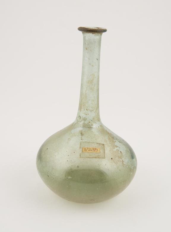 Pale green glass flask with long narrow neck, possibly Roman