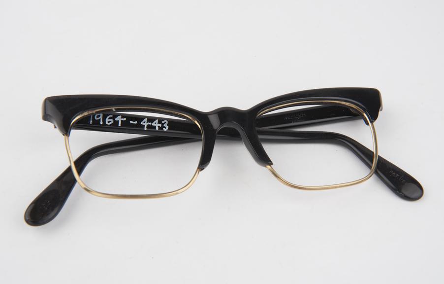 Spectacle frame, brown plastic with brass lens holders