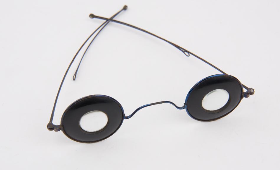 Pair of 'Martins Margins' spectacles with round convex lenses