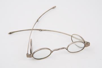 Pair of silver folding spectacles with integral hinged extra lenses