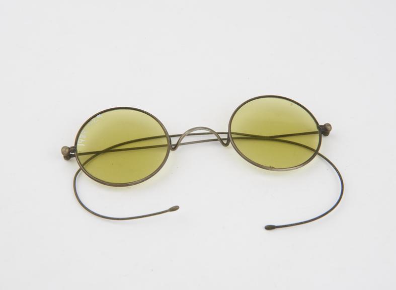 Pair of yellow tinted sun spectacles, marked ANGLETTE PAT