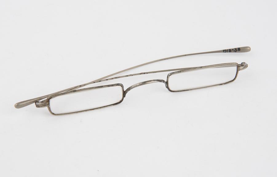 Steel framed spectacles with rectangular lenses and simple