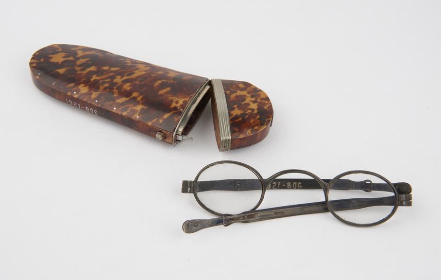 Pair of silver-rimmed spectacles with sliding extendable arms