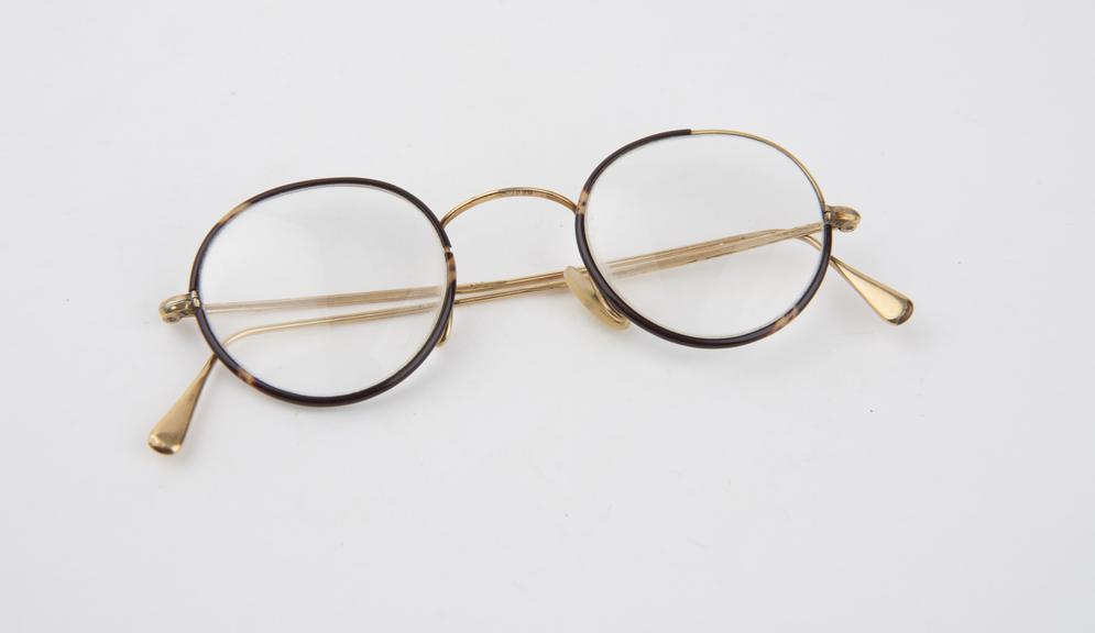 Pair of wire framed round lens spectacles, male style