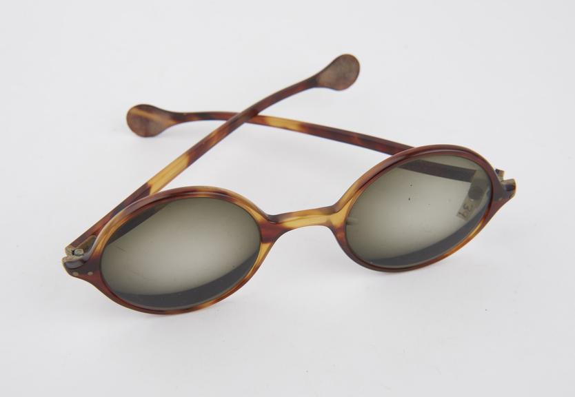 Pair of plastic round framed sunglasses, unisex style