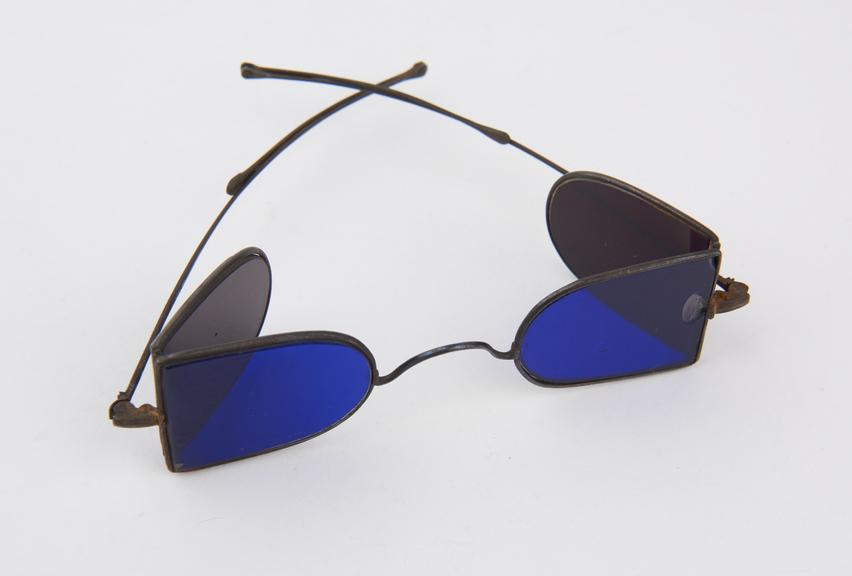 Pair of protective sun spectacles with colbalt blue glass lens