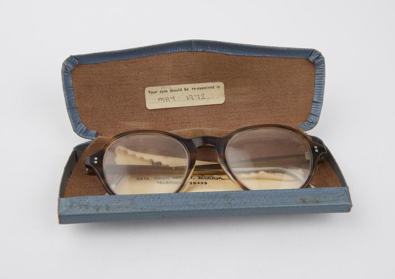 A pair of National Health Service plastic-framed spectacles in