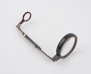 Folding single opera glass with case