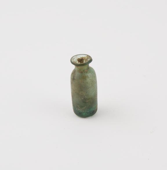 Small green glass bottle, cylindrical, pontil mark, hand blown