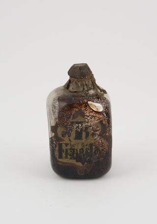 Glass bottle, cork bung, labelled "TR FERRI..."