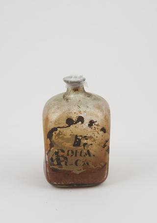 Glass bottle, cork bung, label illegible