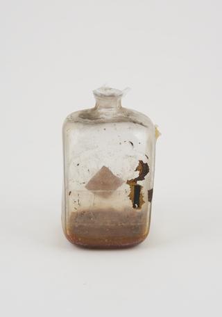 Glass bottle, cork bung, label worn away