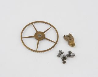 Brass pinion and bracket, plus four machine screws, from French train remontoire clock