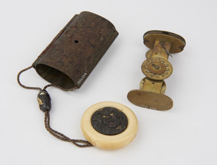 Small Japanese clock in the form of an inro''
