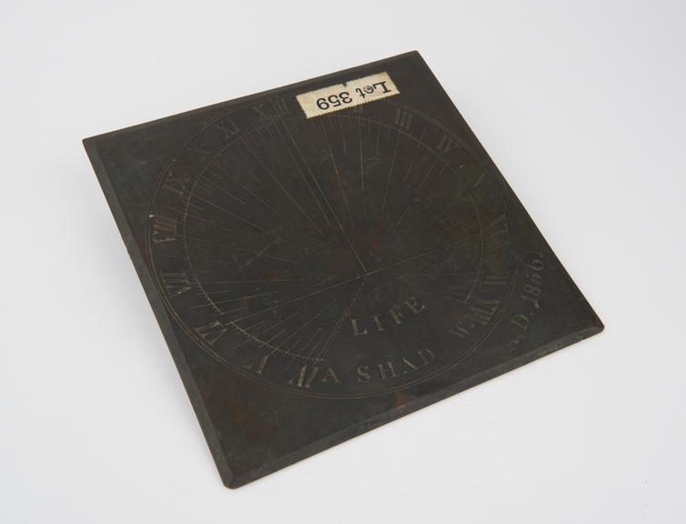 Horizontal sundial in brass inscribed LIFE A SHAD-W A.D. 1856'