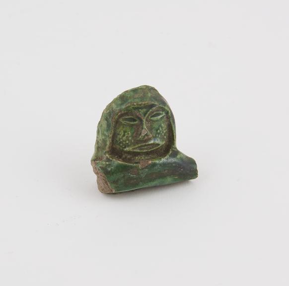 Head, probably fragment from rim of cup, green glazed, Europe