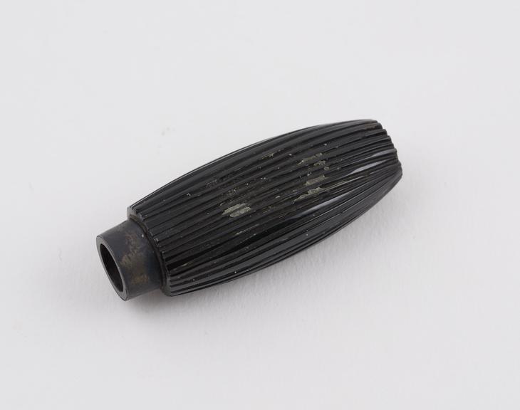 Jet or ebony perfume bottle, oval ribbed body, flattened