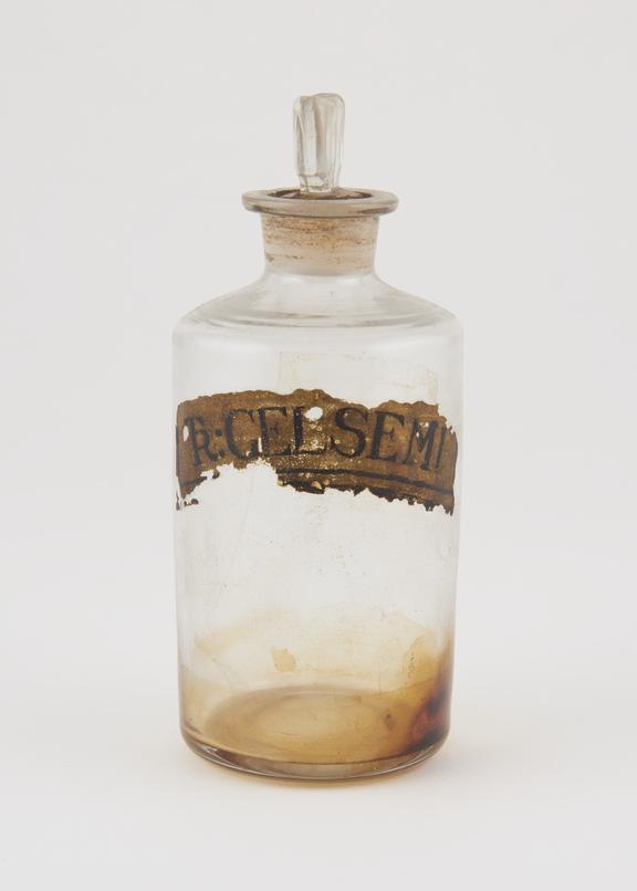 Bottle, clear glass, trace contents, for tincture of gelsemium