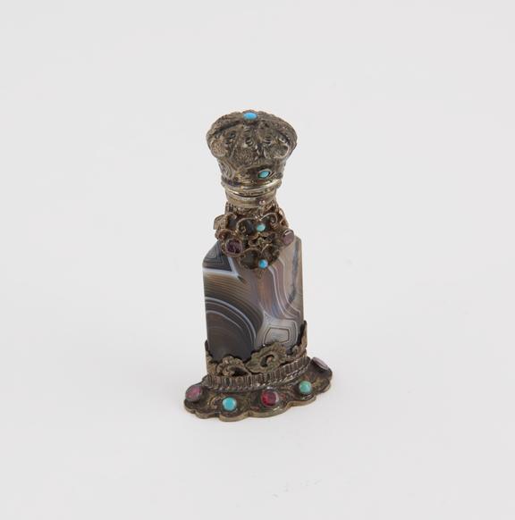 Perfume bottle, carved from agate, mounted in silver