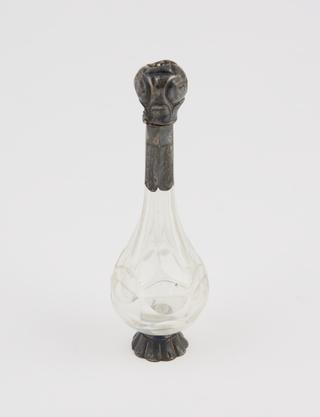 Cut glass perfume bottle with pear-shaped body and long cylindrical neck