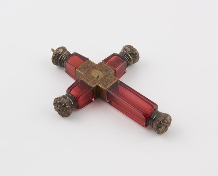 Glass perfume bottle in the form of a cross