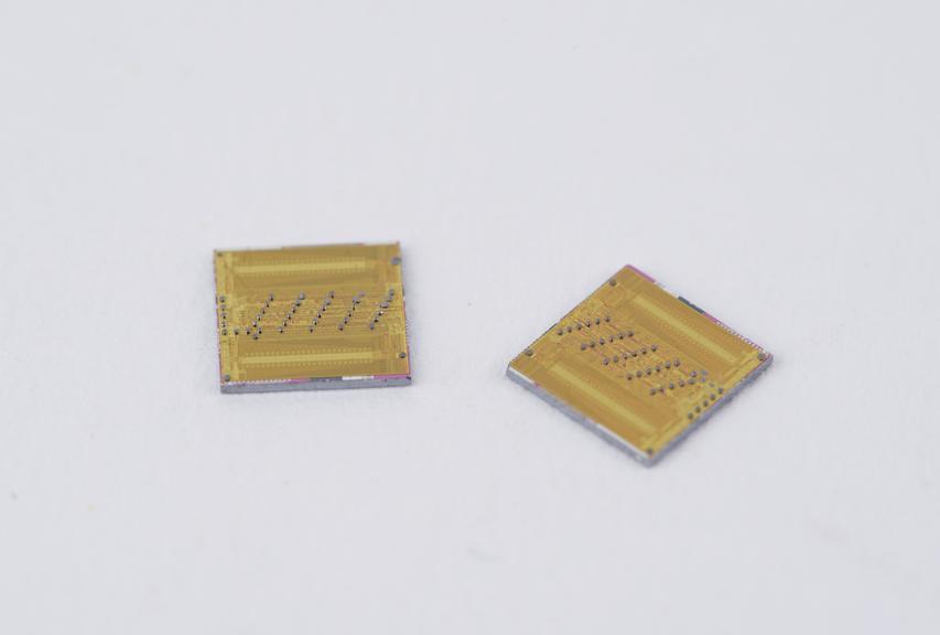 Two 64k bit random access storage silicon chips (unmounted) as