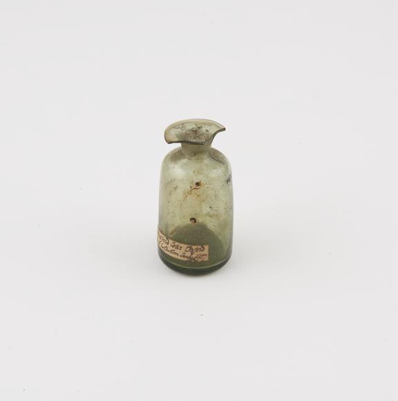Small green glass bottle, cylindrical, with pontil mark