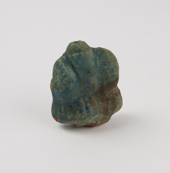 Votive Priapus made of blue glazed faience