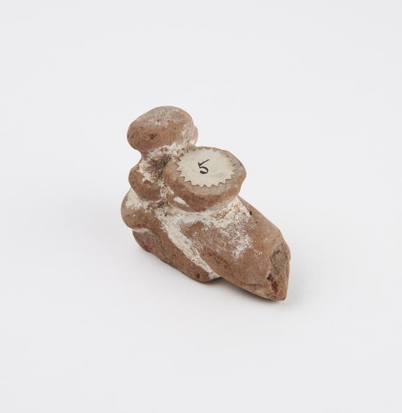 Unglazed terracotta phallic figure, slightly damaged