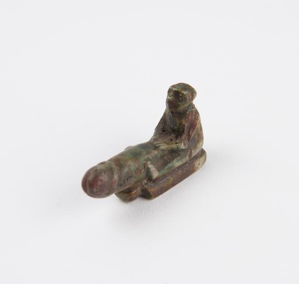 Small glazed green faience phallic figure