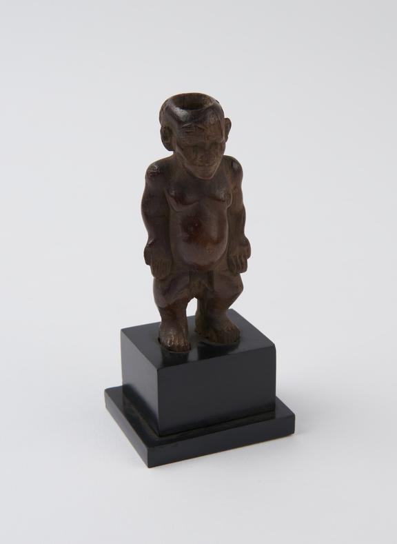 Wooden kohl pot in the form of a standing male figure, unsigned