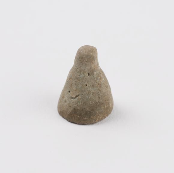 Grey cone earplug with spheroid at vertex