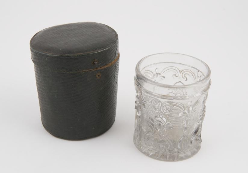 Glass tumbler, possibly a medicine glass, in original box