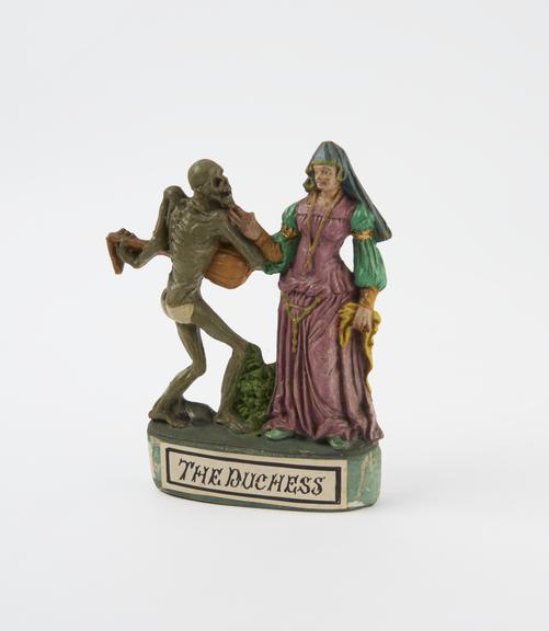Statue of cadaver with a lute