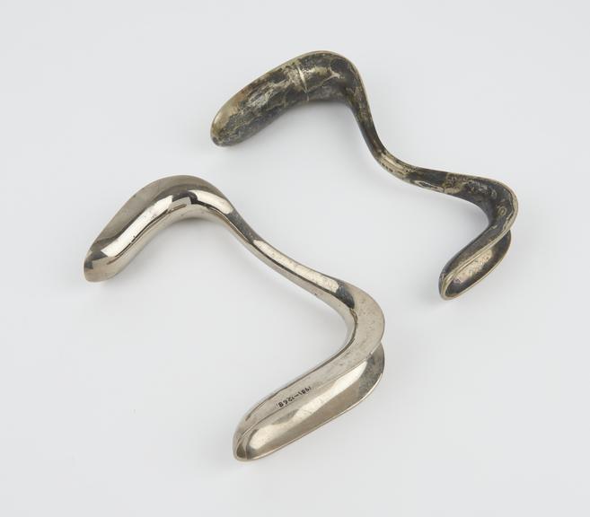 Two vaginal specula, Sims' double duckbill, plated metal