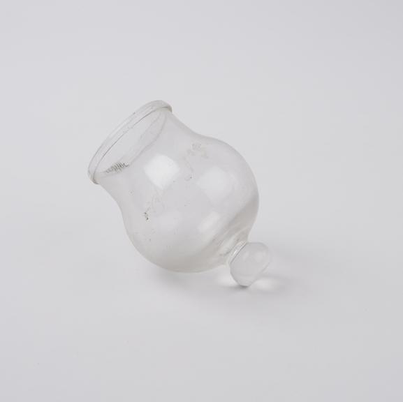 Clear glass bleeding cup with solid glass knob at base