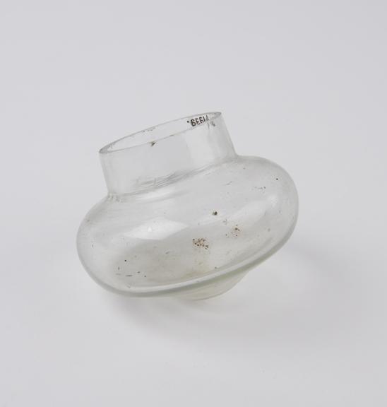 Clear glass bleeding cup, squat bulbous shape, from Algeria