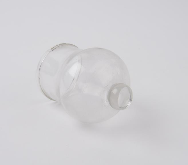 Clear glass bleeding cup with solid glass knob at base